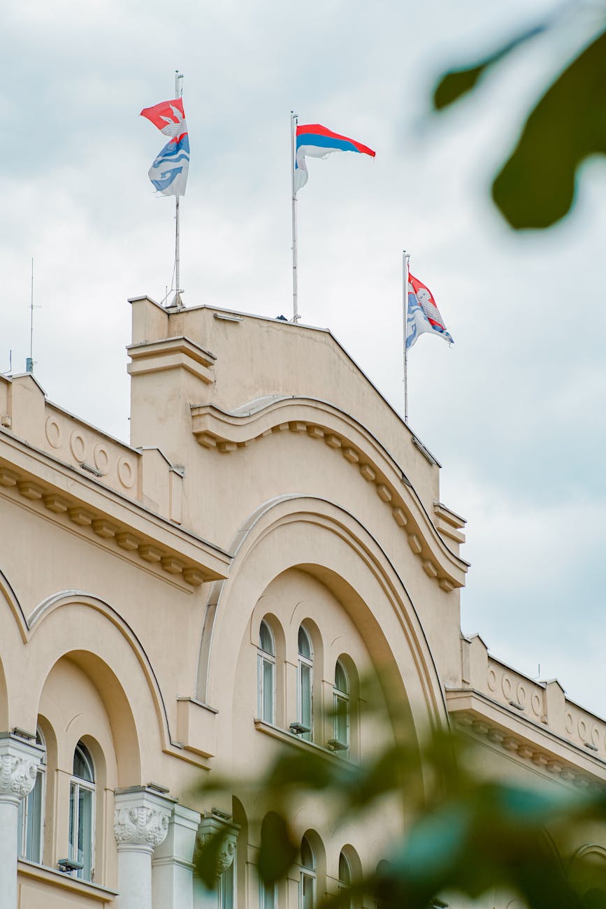 flags of banja luka fluttering on top of a building